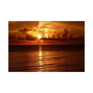Ocean Sunset Through The Clouds